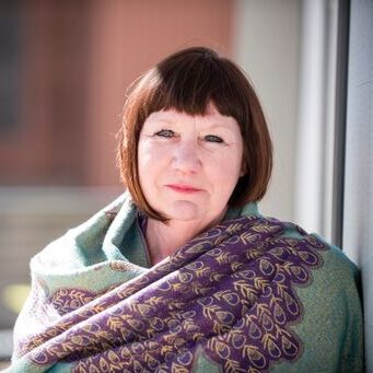 Christine smiles in her headshot
