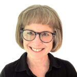 Betsy smiles in her headshot