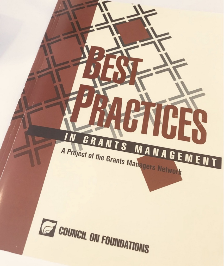 A shot of the Best Practices in Grants Management, which features brown-red and cream background designs. The cover reads "Best Practices in Grants Management. A Project of Grants Managers Network. Council on Foundations."