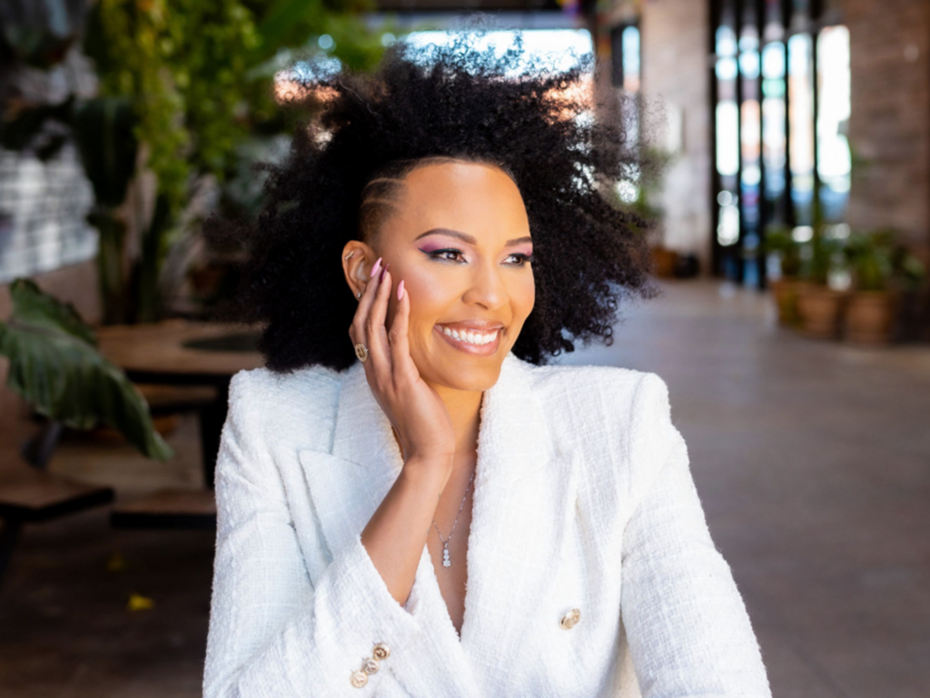 CarolLaine Garcia looks to the side with her hand touching her face