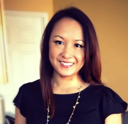 Elaine smiles in her headshot