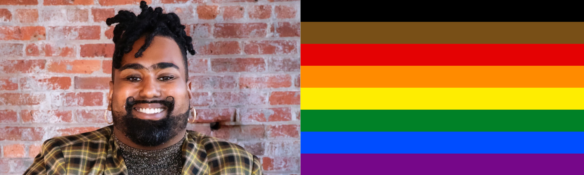 Sol Soler smiles for the camera, posed in front of brick wall.