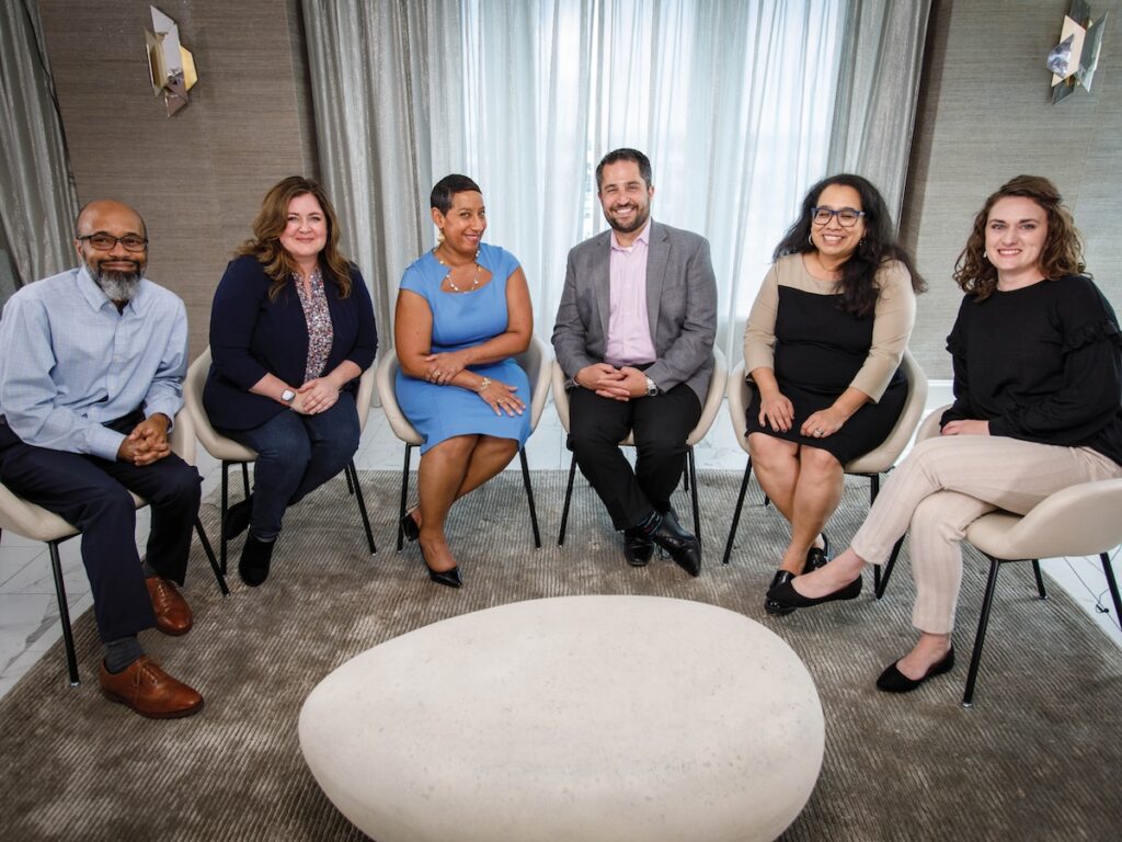 Anthony Simmons, Amber Lopez, Satonya Fair, Chris Percopo, Dolores Estrada, and Kelli Rojas smile for a group picture during their roundtable conversation at PEAK2023.