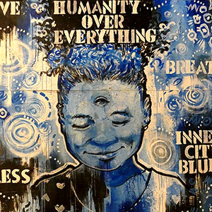 This piece is a small version of the linked image. It shows a young Black girl painted in blues, blacks, and creams. Her eyes are closed, but a third eye is opened on her forehead. The phrases "Humanity over everything," "Breathe," "Inner City Blues," and "Bless" are stenciled in.