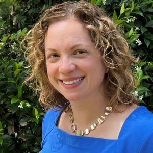 Lita smiles in her headshot.