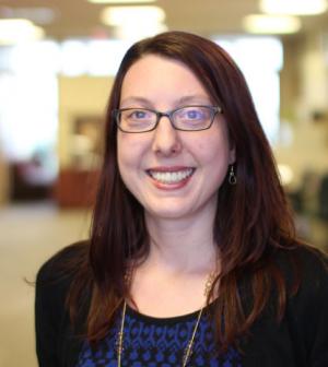 Andrea smiles in her headshot
