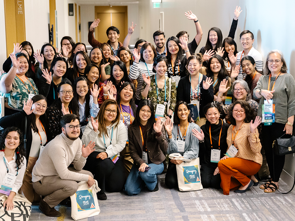 Members of the PEAK AANHPI Caucus pose for a group picture at PEAK2024