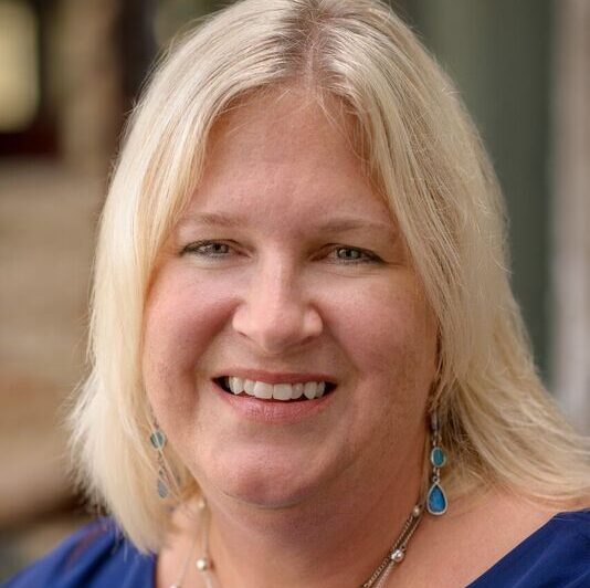 Stephanie smiles in her headshot
