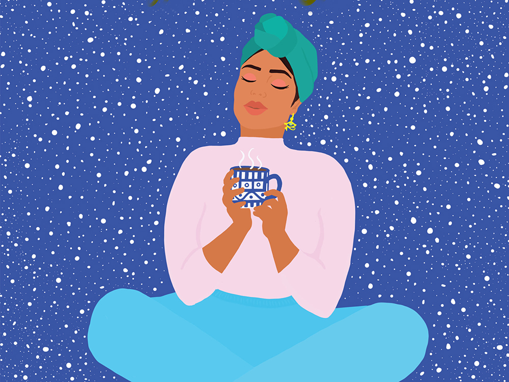 A woman sits peacefully in front of a dark blue background with white, starry speckles. She holds a mug of a warm beverage, her eyes are closed.