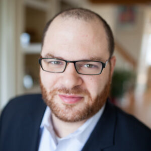 A headshot photo of Rusty Stahl